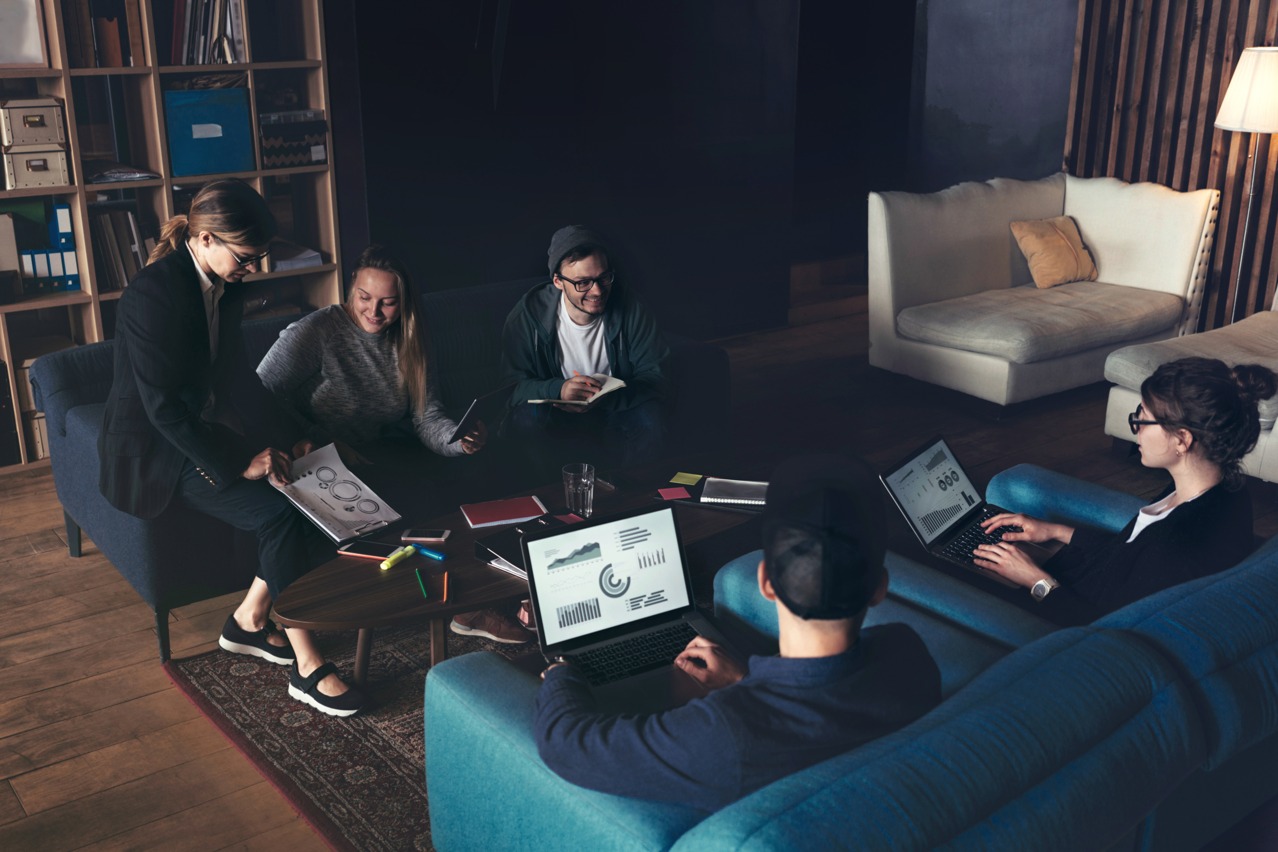 Business group discussing new plan. Team meeting on the couch. B